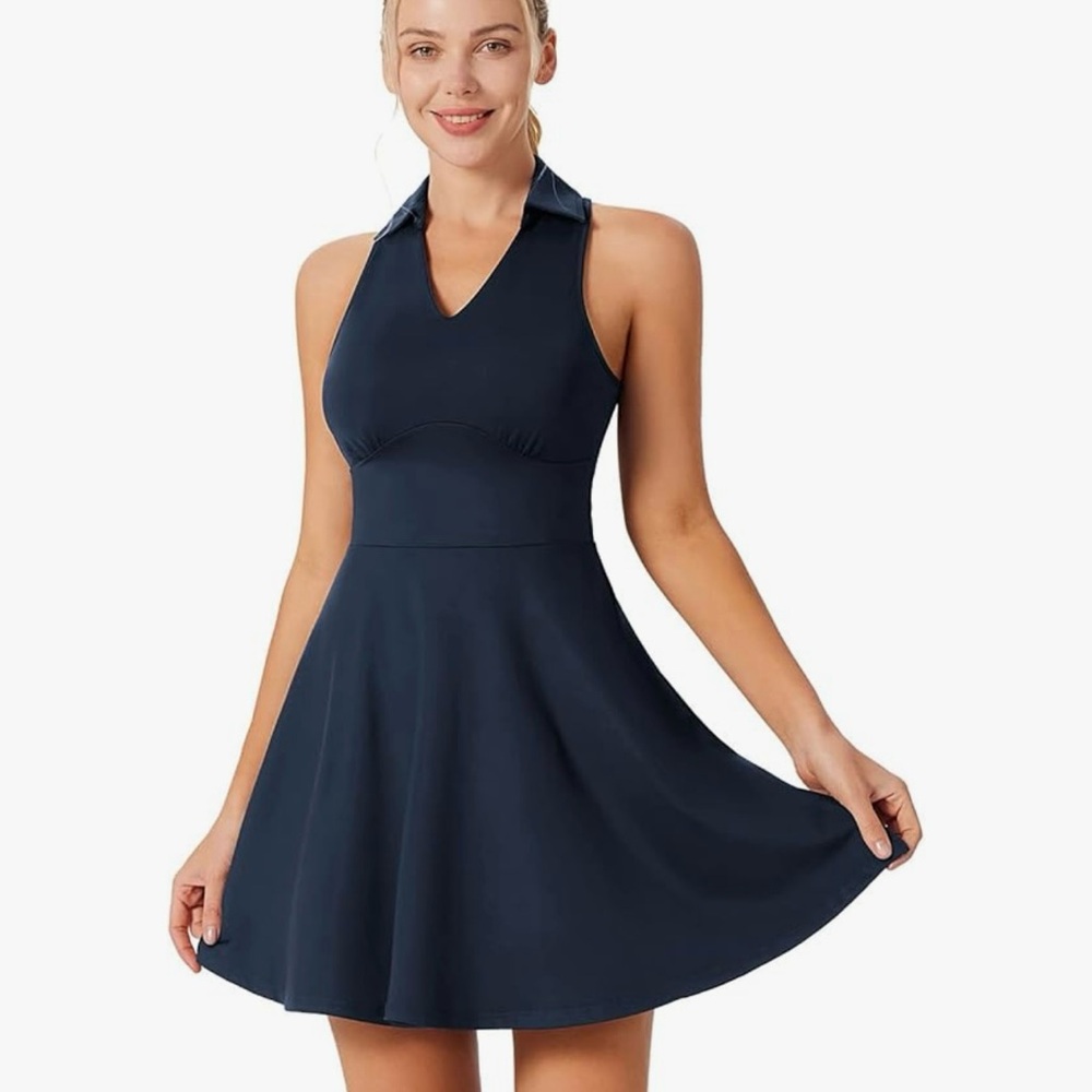 Sleeveless dress. Navy blue, racer back, built in bra.  Skirt hits knee length.